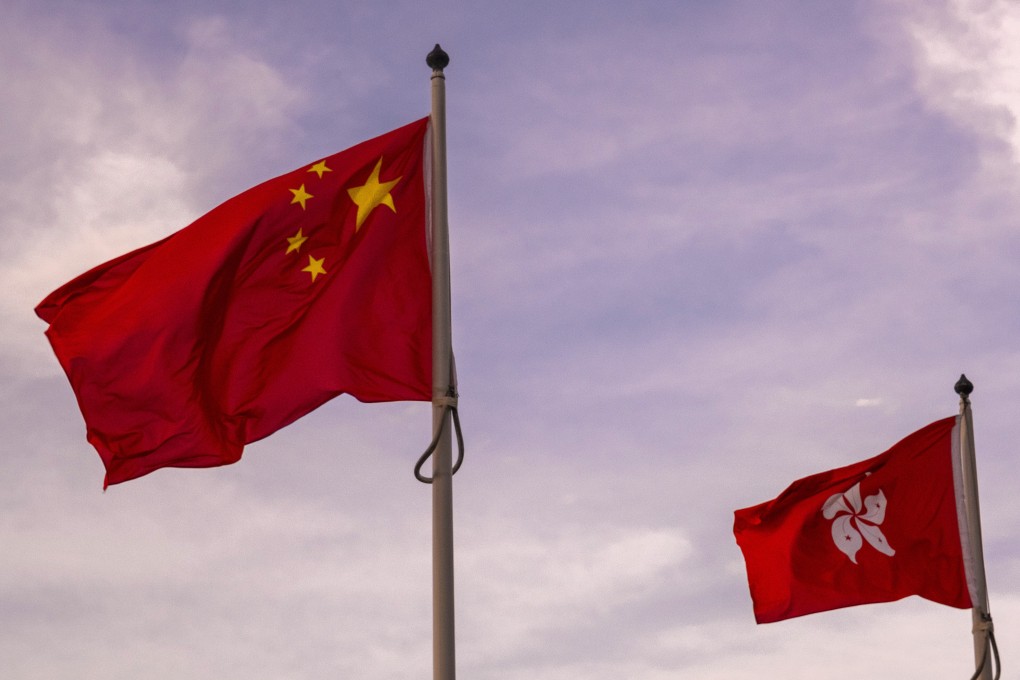 The Chinese flag and the Hong Kong flag fly outside City Hall in Central, Hong Kong. Photo: Sun Yeung
