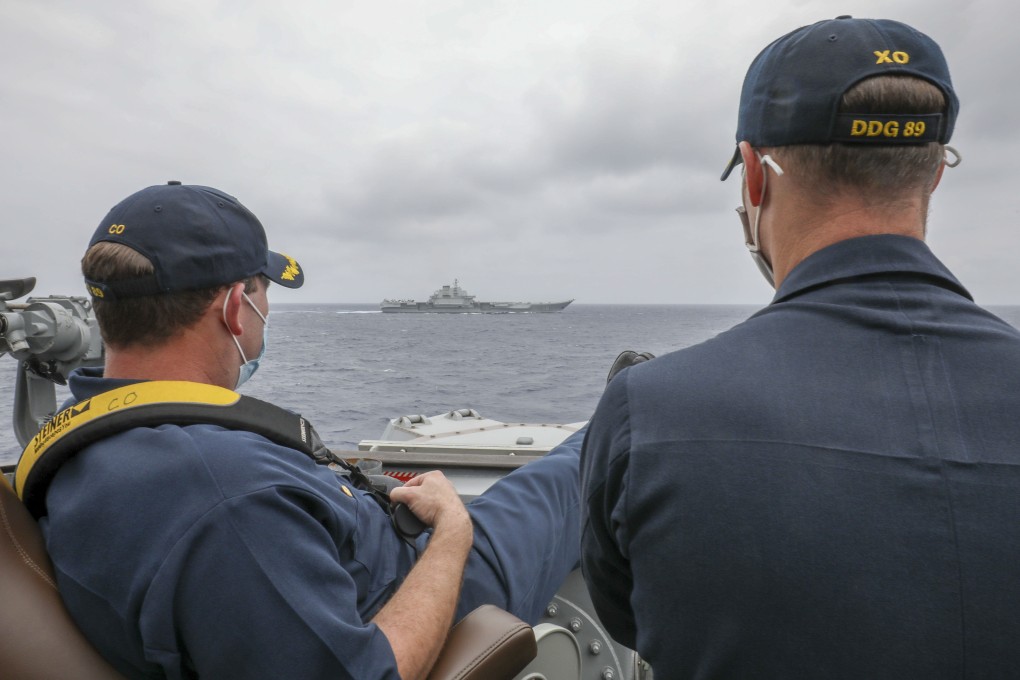 US Navy officers aboard the guided missile destroyer USS Mustin monitor a Chinese vessel in the East China Sea on April 4. Photo: US Navy