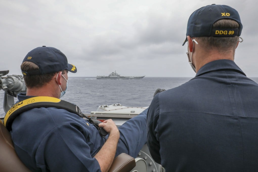 US Navy officers aboard the guided missile destroyer USS Mustin monitor a Chinese vessel in the East China Sea on April 4. Photo: US Navy