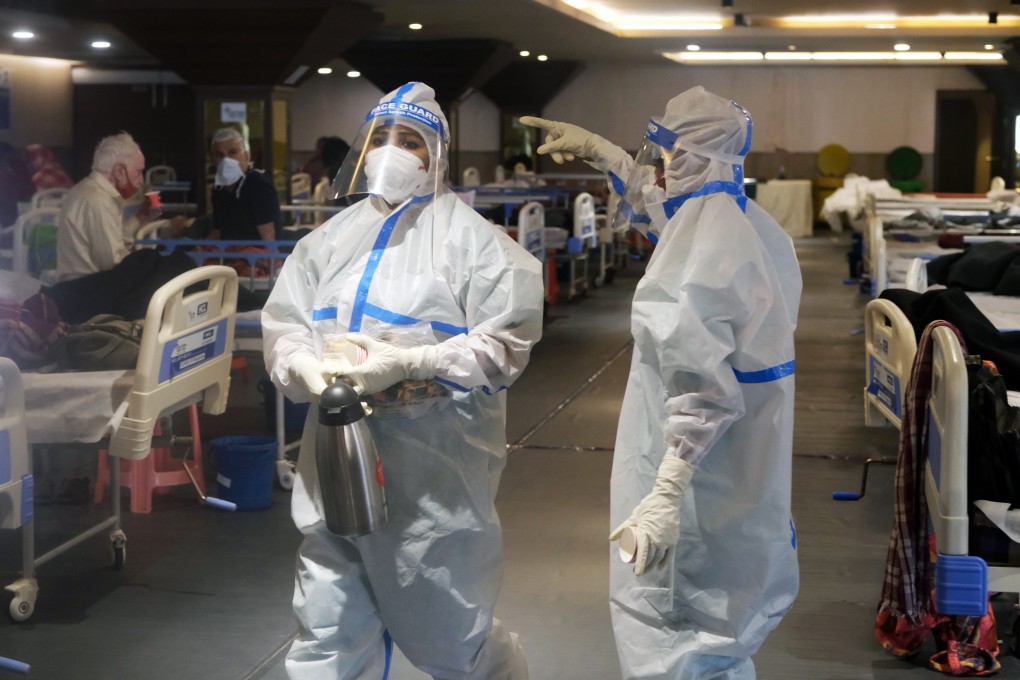Health workers in protective gear care for patients at a makeshift Covid-19 quarantine facility set up in a banquet hall in New Delhi on Tuesday. Photo: Bloomberg