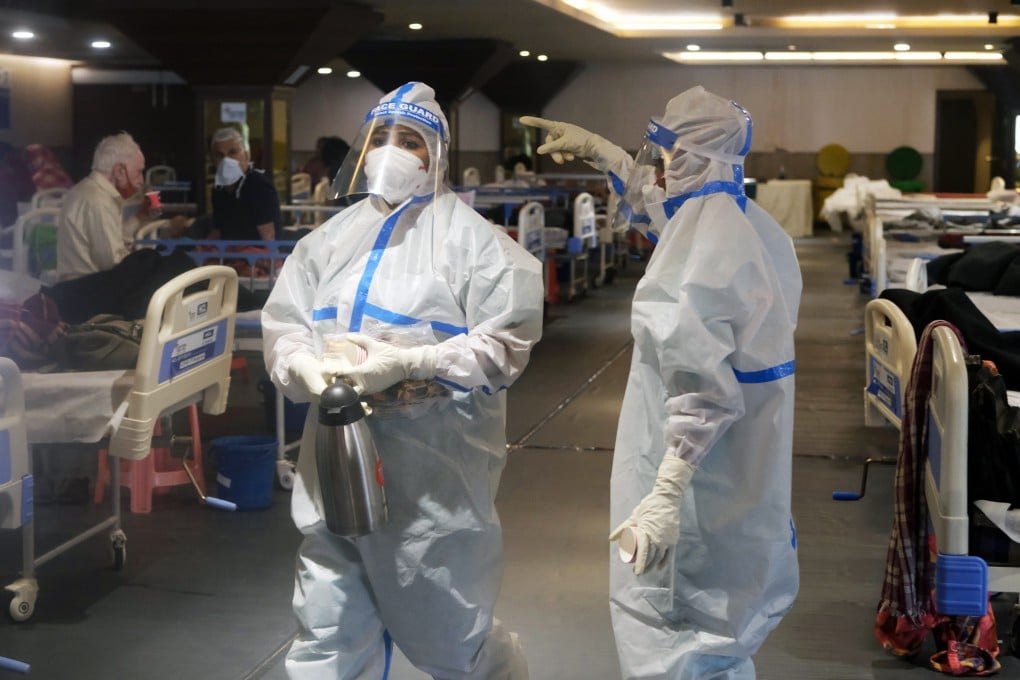 Health workers in protective gear care for patients at a makeshift Covid-19 quarantine facility set up in a banquet hall in New Delhi on Tuesday. Photo: Bloomberg