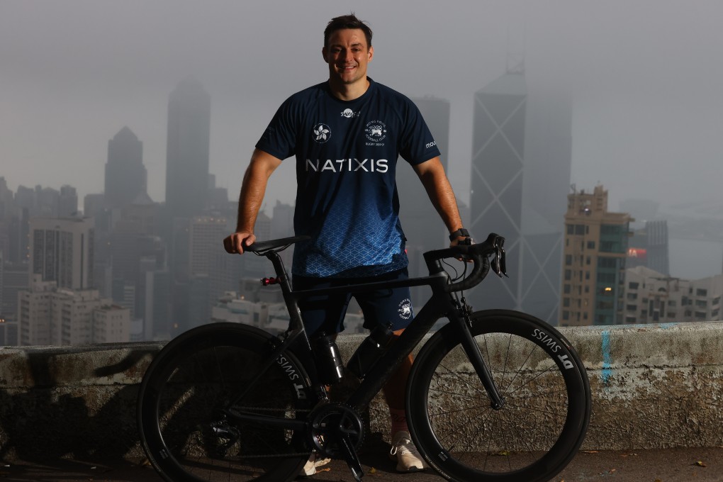 Hong Kong Football Club senior rugby player John McCormick-Houston with his bike on Magazine Gap, Mid-levels to raise money for the HKFC Rugby to Hanoi charity programme in April. Photo: SCMP / Dickson Lee