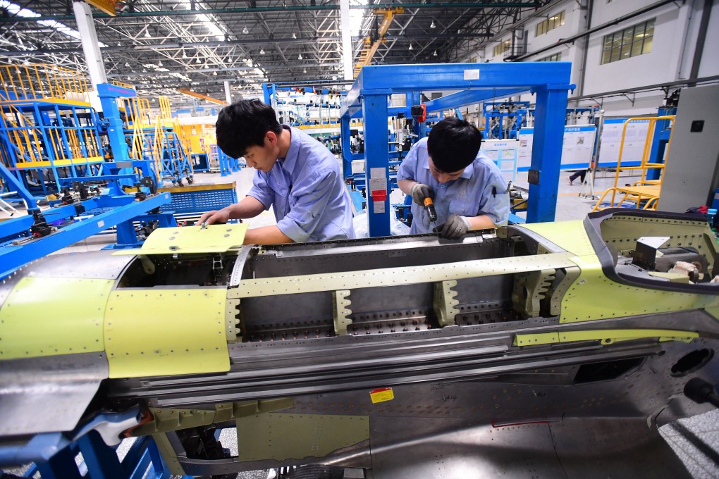 Workers assemble part of the engine for China’s C919 passenger aircraft at a factory of Shenyang Aircraft Corporation in Shenyang, Liaoning province. Photo: Reuters