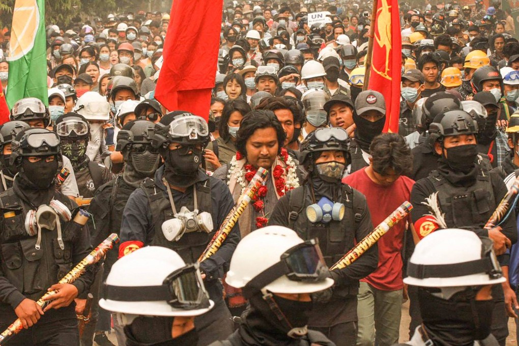 Activist Wai Moe Naing (centre) is seen during an earlier demonstration against the military coup. He was arrested on Thursday morning. Photo: AFP