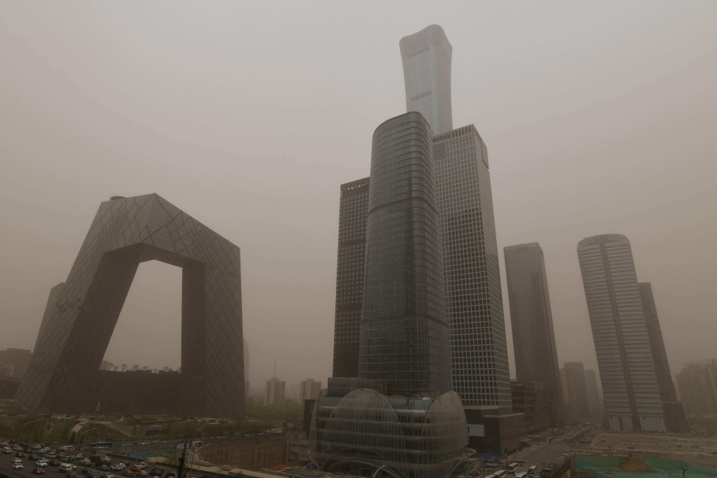 Buildings are seen in the central business district during a sandstorm in Beijing on Thursday. Photo: AFP