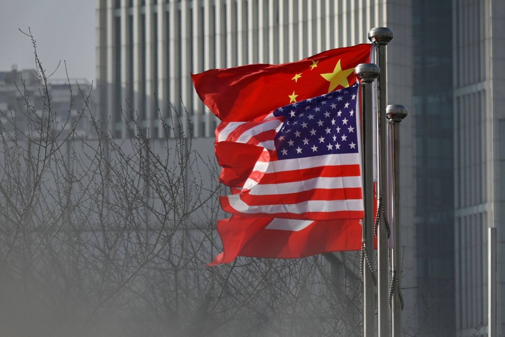 Chinese and US national flags flutter at the entrance of a company office building in Beijing. Photo: AFP