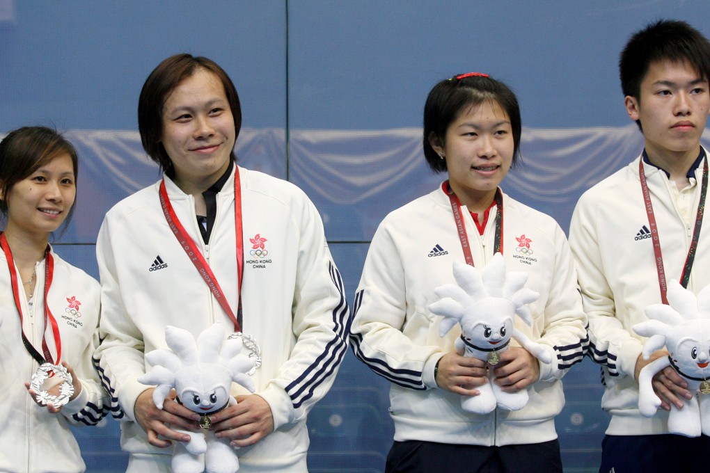 Annie Au Wing-chi (second from right) and younger brother Leo Au Chun-ming captured the mixed doubles gold medal for Hong Kong at 2009 East Asian Games while Rebecca Chiu Wing-yin (left) and Roger Ngan Lun-cheung are second for silver. SCMP pictures.