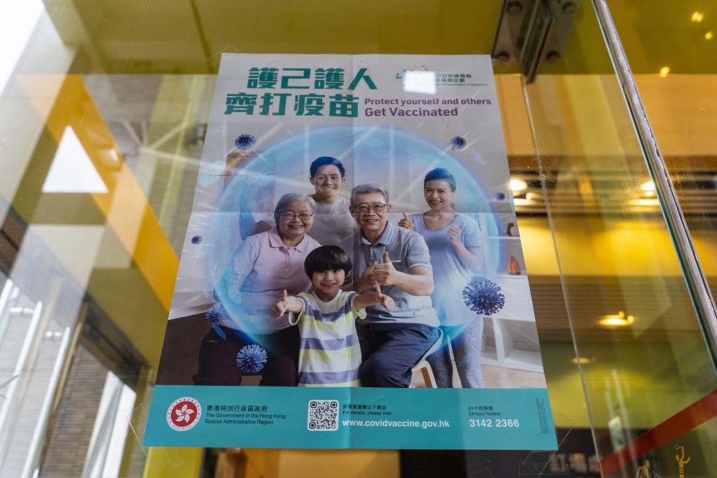 A poster promoting the vaccination programme is posted outside a community vaccination centre in Hong Kong on April 5. As of last Thursday, about 967,000 doses of Covid-19 vaccines had been administered in Hong Kong, including some 640,600 people, or 8.5 per cent of the city’s population, who had received their first dose. Photo: Bloomberg