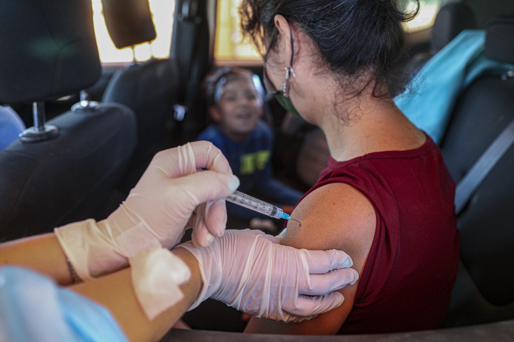 A woman is injected with a dose of the Sinovac Covid-19 vaccine in Santiago, Chile. File photo: AP
