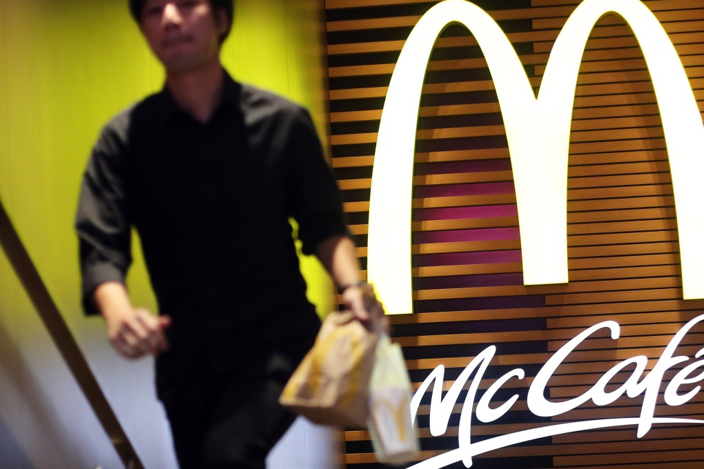 A customer carries a takeaway meal out of a McDonald’s outlet in Tsim Sha Tsui in January 2018. Photo: Winson Wong