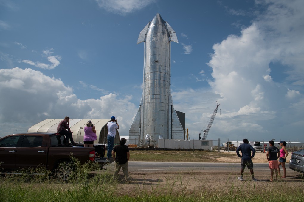 Enthusiasts look at a prototype of SpaceX’s Starship spacecraft at the company’s Texas launch facility in September 2019. Photo: TNS