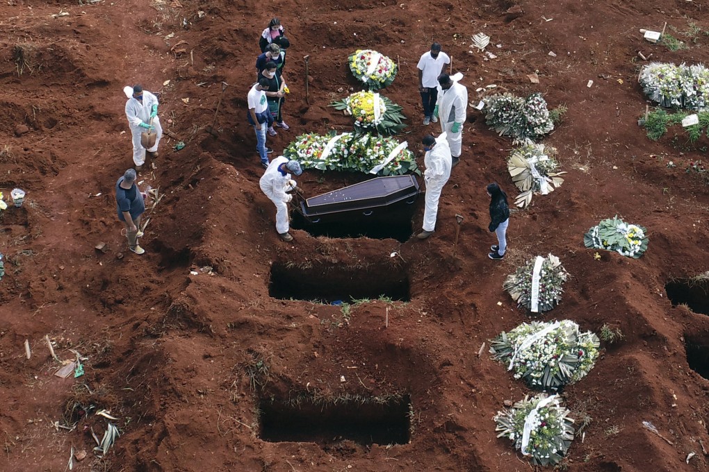 Cemetery workers in Brazil bury a victim of Covid-19, which has now claimed 3 million lives around the world. Photo: AP
