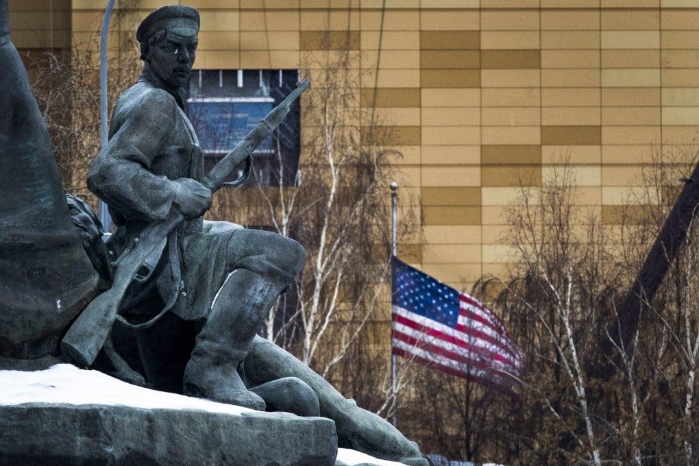 The US flag is seen at the country’s embassy in Moscow, behind a monument to the Workers of 1905 Revolution. Photo: AP