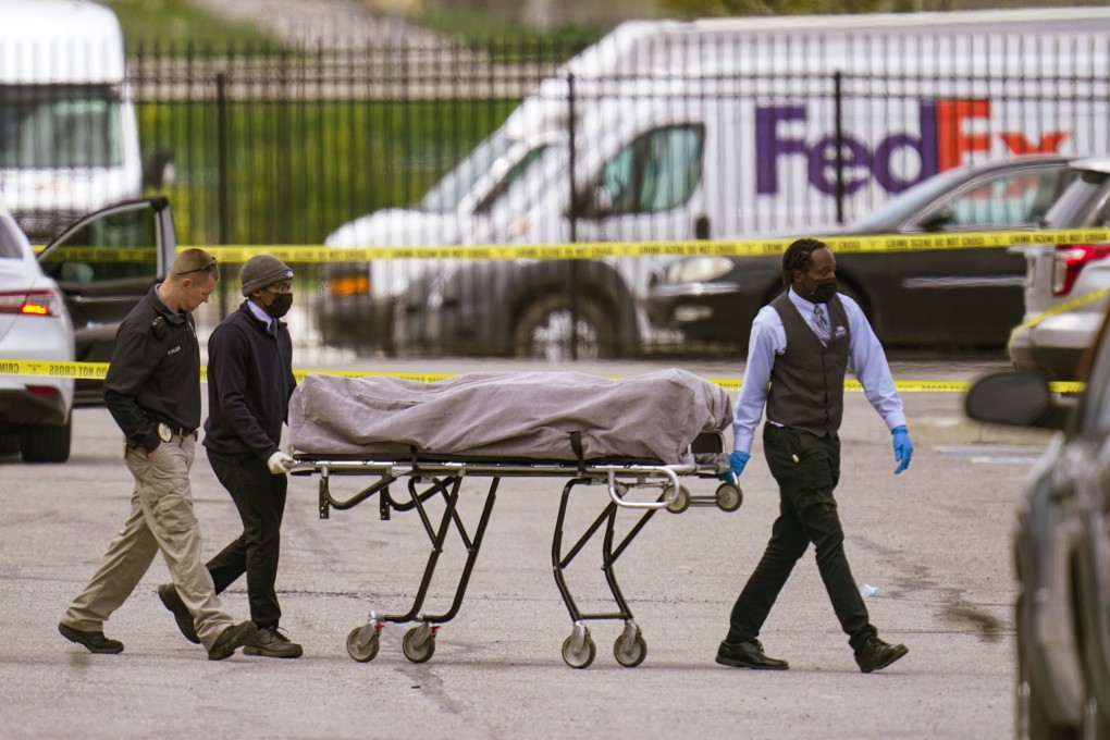 A body is taken from the scene on Friday where multiple people were shot at a FedEx Ground facility in Indianapolis. Photo: AP