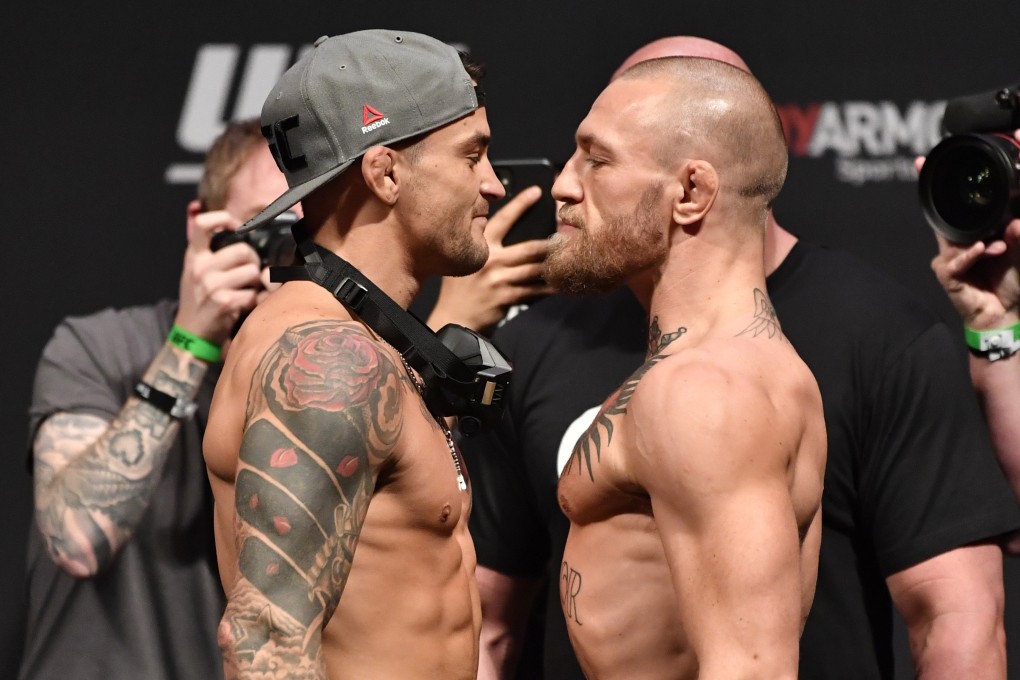 Dustin Poirier (left) and Conor McGregor face off during the UFC 257 weigh-in. Photo: Jeff Bottari/Zuffa LLC