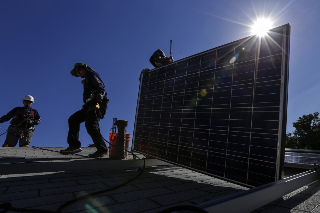 A crew installs a solar system on a home. Photo: TNS
