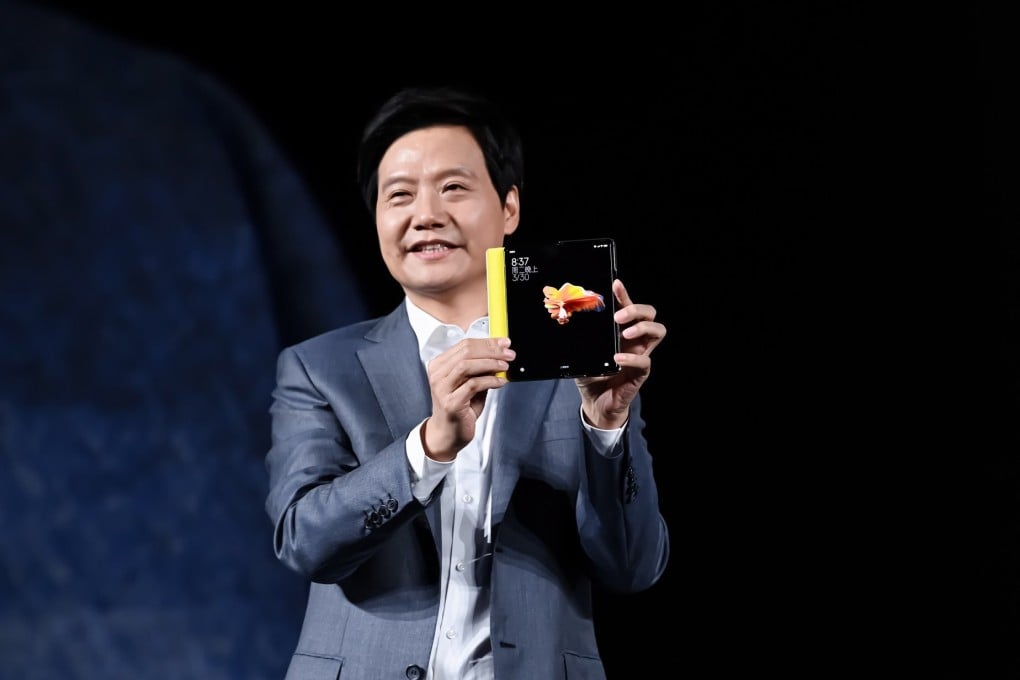 Xiaomi co-founder Lei Jun shows the new foldable smartphone Mi Mix Fold during an unveiling event in Beijing on March 30. Photo: EPA-EFE