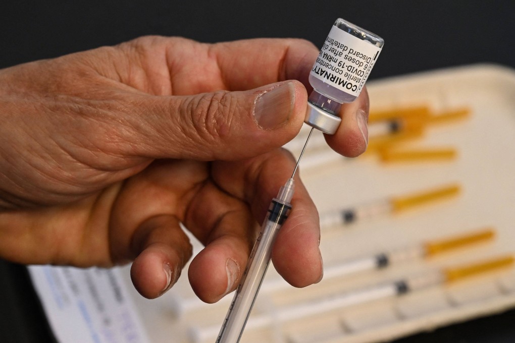 A nurse prepares a dose of the Pfizer/BioNTech vaccine against Covid-19 at a vaccination centre. Photo: AFP