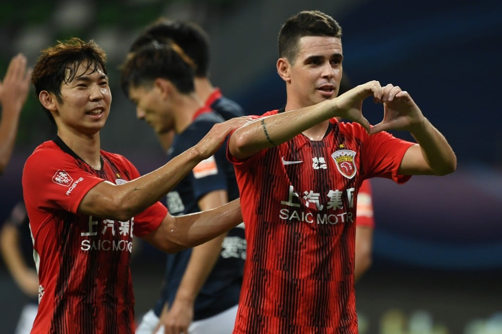 Oscar (right) of Shanghai SIPG celebrates after scoring against Chongqing Dangdai Lifan in the postponed 2020 season Chinese Football Super League. Photo: Xinhua