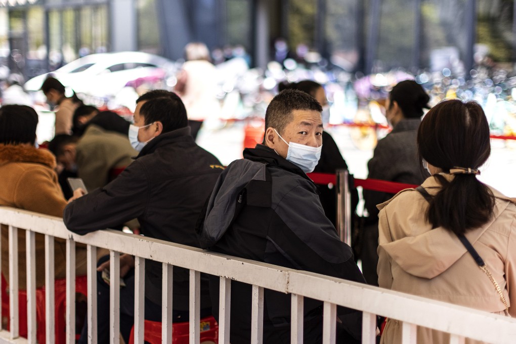 Residents line up for vaccinations in Wuhan, China. A trial is under way to see if vaccines can be mixed to boost immunity and provide greater flexibility. Photo: Getty Images/TNS