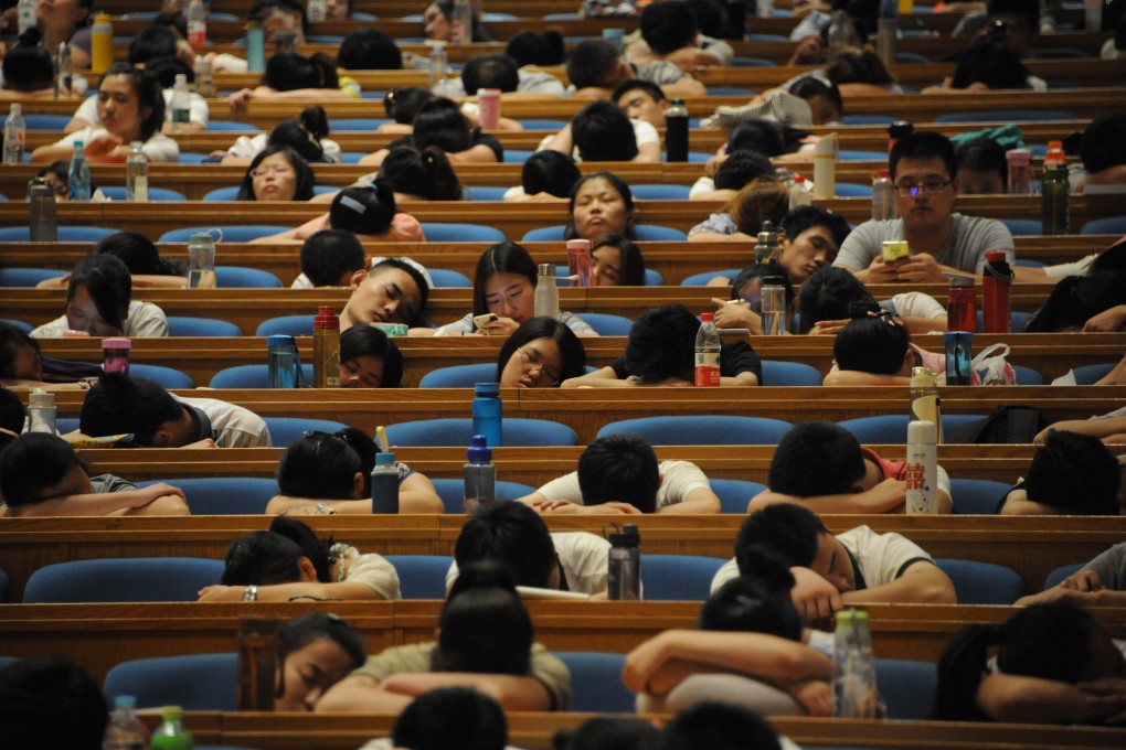 Students take naps in an assembly hall in Jinan, Shandong province, China. Taking a nap may be good for us - studies indicate it improves memory, reduces stress and boosts the immune system. Photo: Getty Images