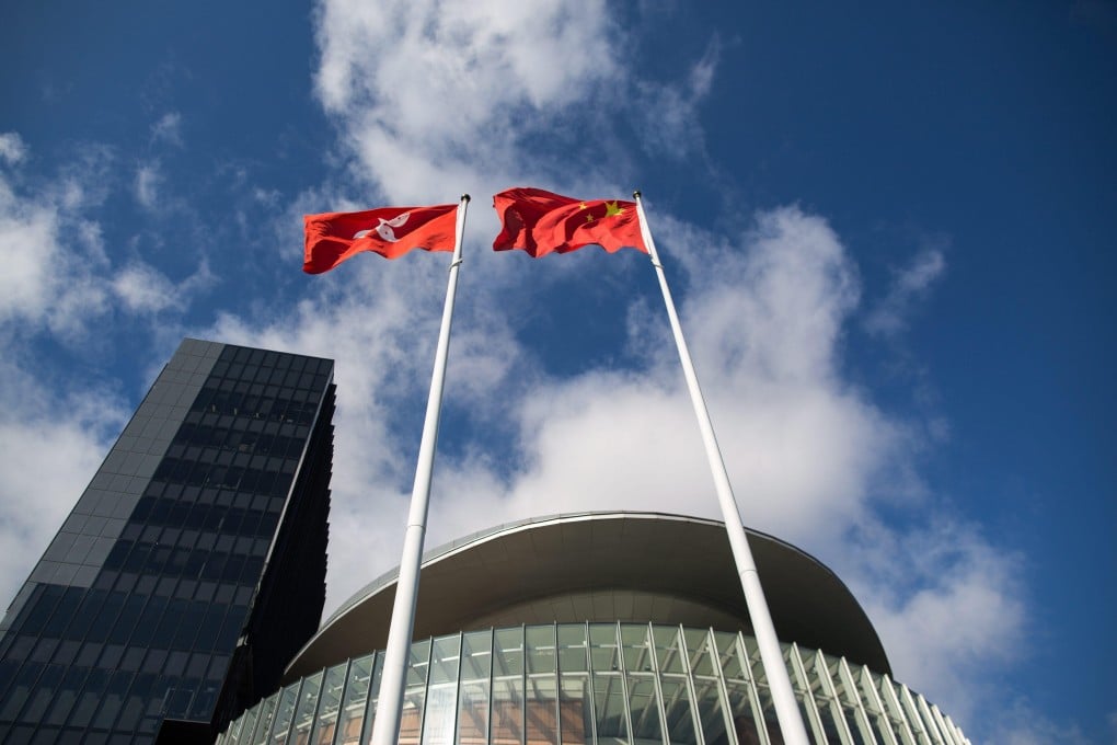 The Chinese flag and the Hong Kong flag fly on masts outside the Legislative Council in Hong Kong. Photo: EPA