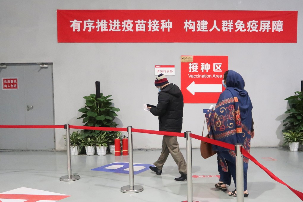 People arrive to get a Covid-19 jab at a vaccination centre in Beijing. Chinese authorities aim to have 40 per cent of the population of 1.4 billion immunised by July. Photo: Reuters