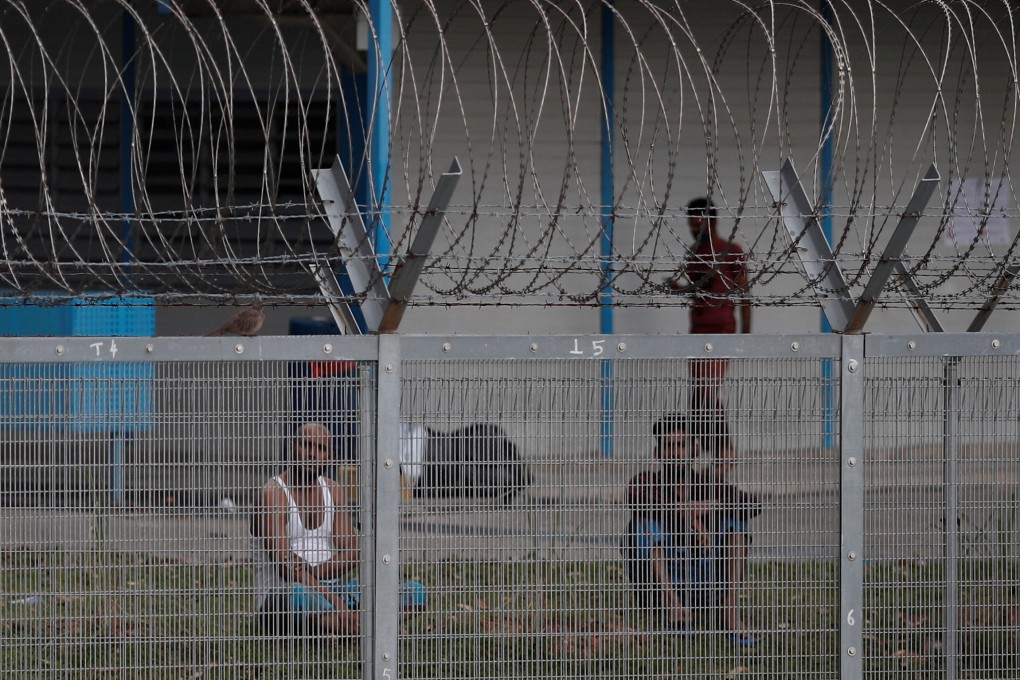 Migrant worker living in a dormitory are seen in April last year, at the height of Singapore’s Covid-19 outbreak. Photo: Reuters