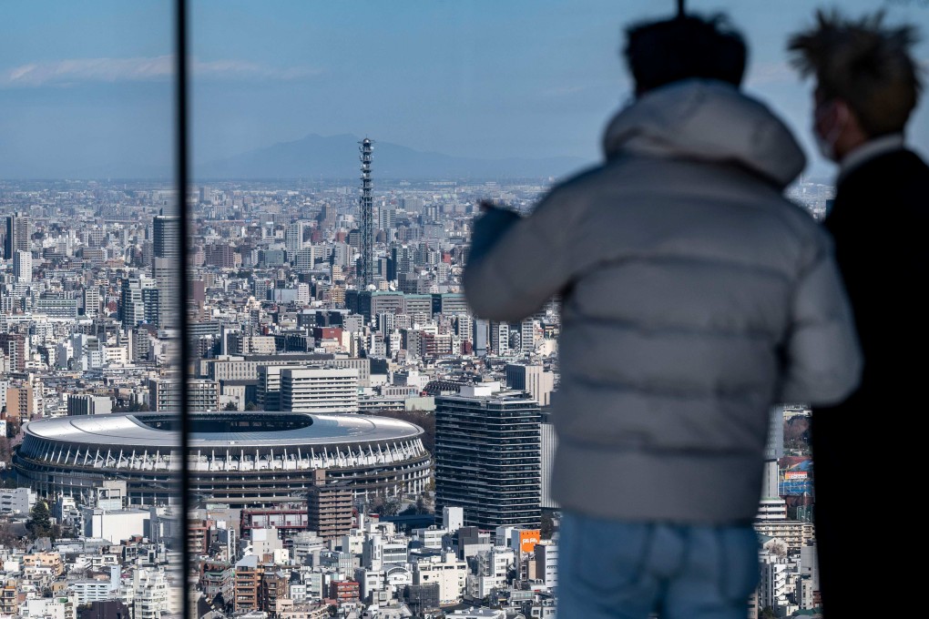 Visitors to the Shibuya Sky observation deck in Tokyo enjoy the view. Photo: AFP