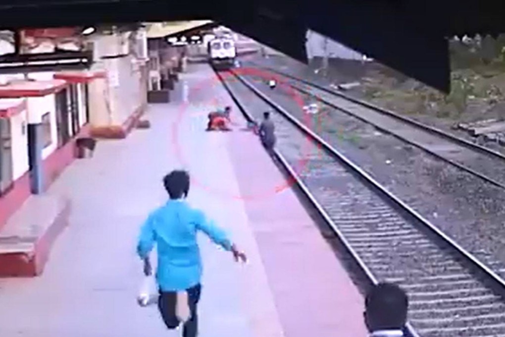 A still from CCTV footage showing railway worker Mayur Shelke’s dramatic rescue of a 6-year-old boy who fell onto the tracks at Vangani station in India. Photo: Twitter