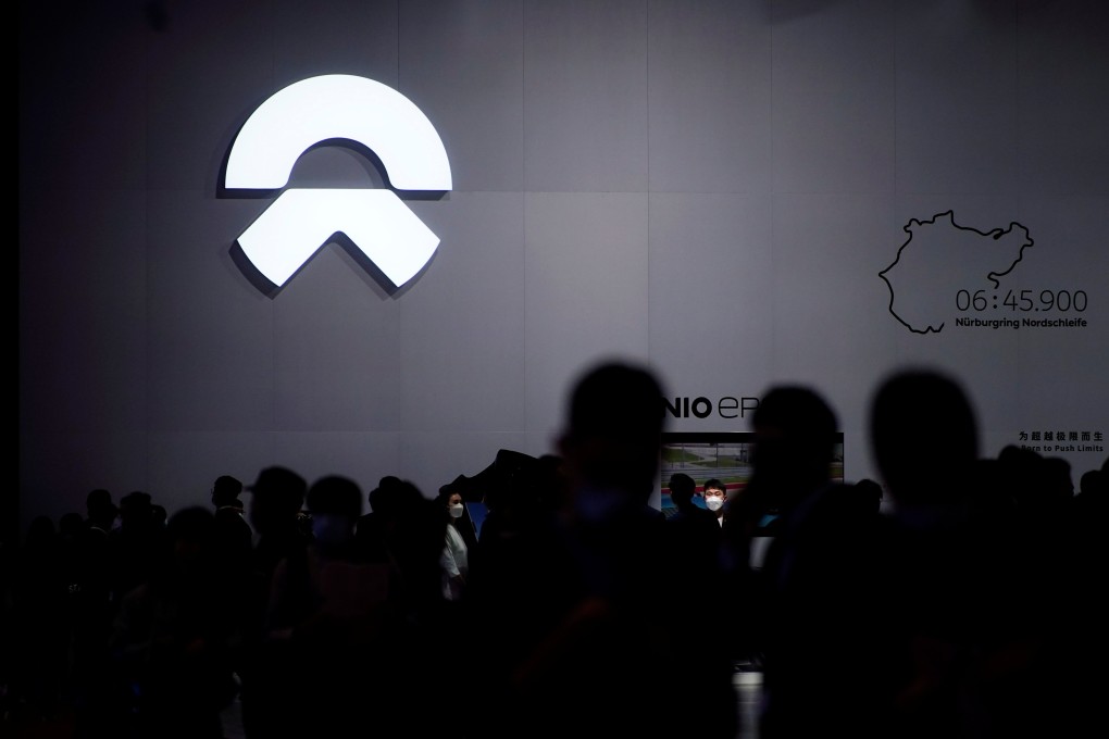 People visit the NIO booth at the Auto Shanghai show. Photo: Reuters