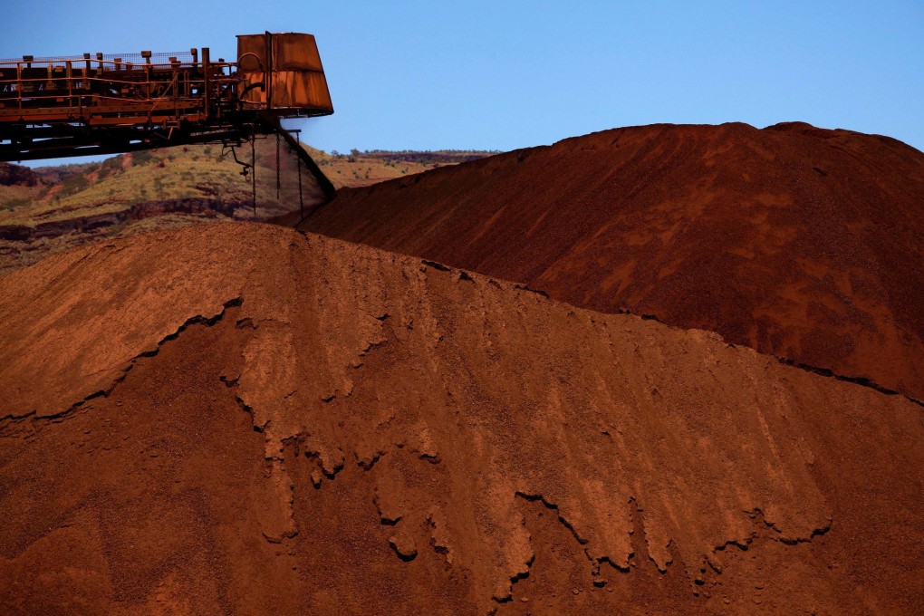 Iron ore is unloaded at a mine in the Pilbara region. Australia extracts vast resource wealth from a continent it has to itself, with 43 per cent of its exports going to China. Photo: Reuters