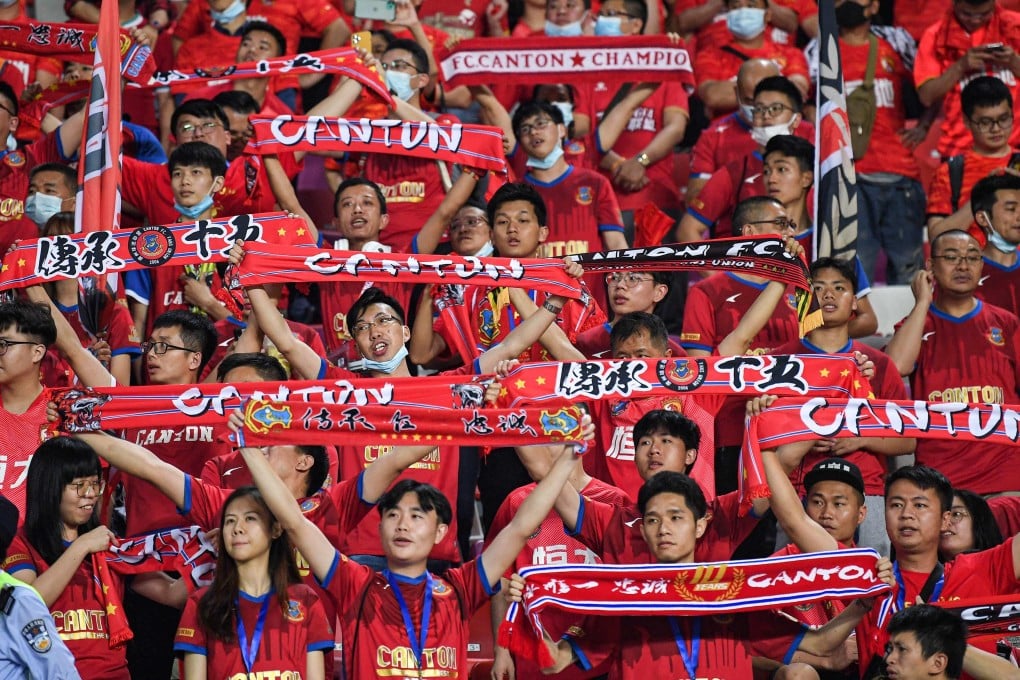 Fans watch the Chinese Super League football match between Guangzhou FC and Guangzhou City. Photo: AFP