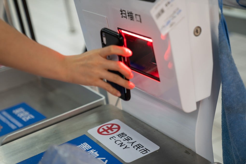 Signage for the digital yuan at a self check-out counter inside a supermarket in Shenzhen. Photo: Bloomberg