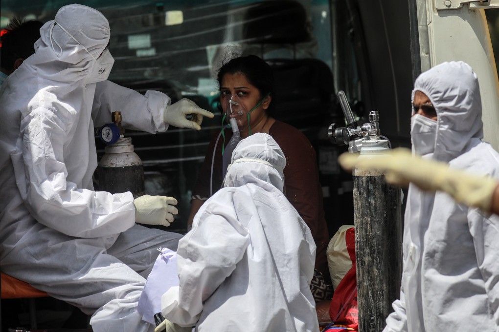 Medical workers attend to a suspected Covid-19 patient at a health centre in Mumbai on Thursday. Photo: EPA