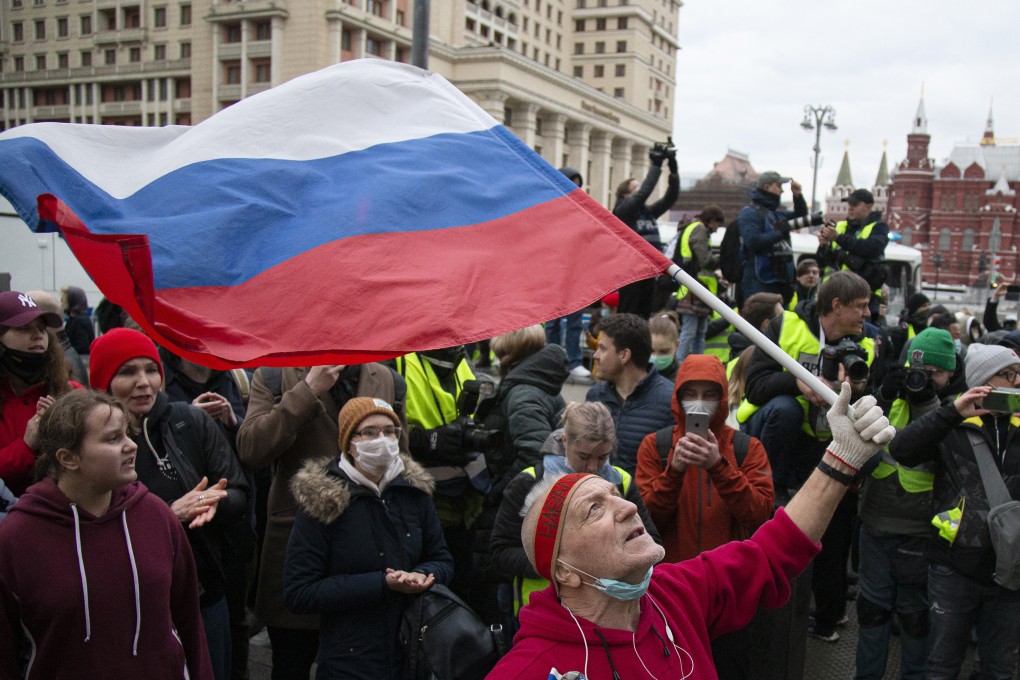 A supporter waves the Russian flag and shouts slogans during a rally in support of jailed opposition leader Alexei Navalny in the centre of Moscow near Red Square on Wednesday. Photo: AP