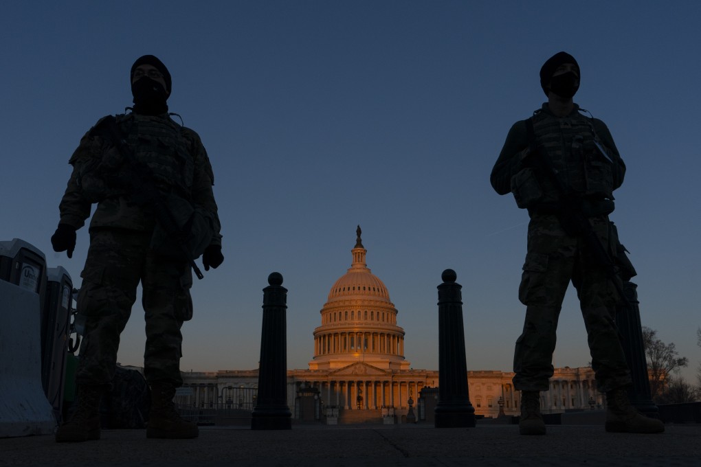 National Guard stand at their posts outside the US Capitol in Washington on March 8, 2021. File photo: AP