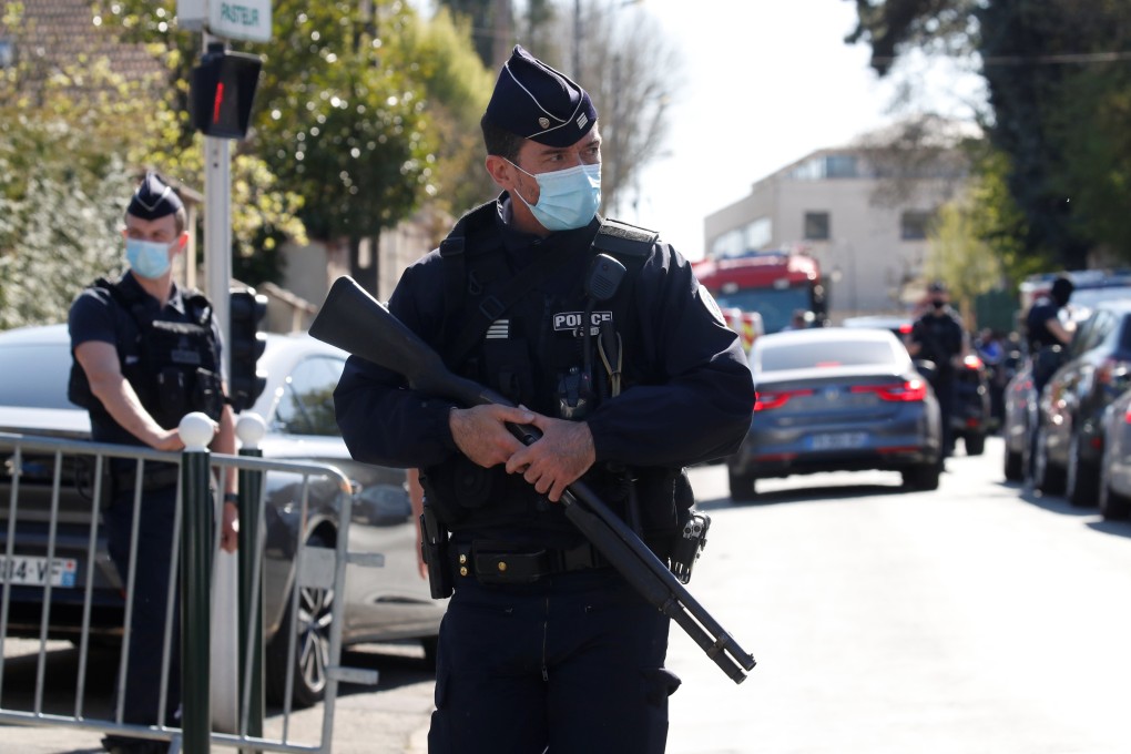 Police officers secure the area where an attacker stabbed a female police administrative worker in Rambouillet near Paris. Photo: Reuters