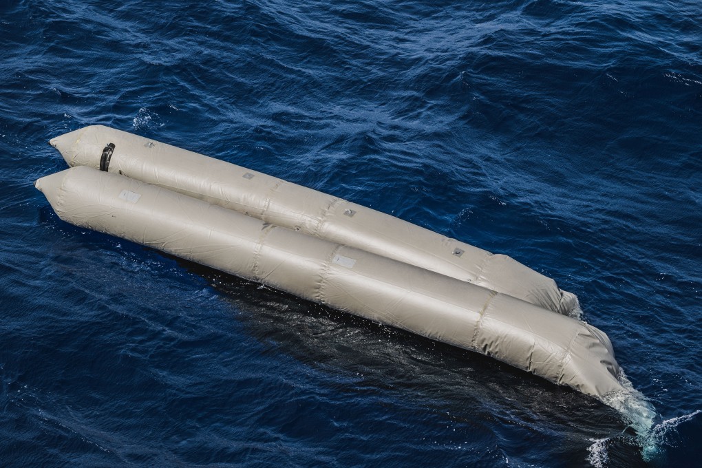 A rubber boat floats in the Mediterranean off the Libyan coast. Photo: Reuters