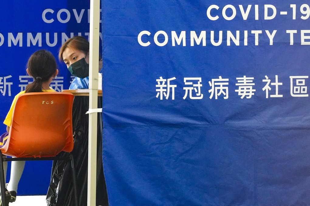 Pupils are screened for Covid-19 at a mobile testing point stationed at a school in Tai Wai. Photo: Winson Wong