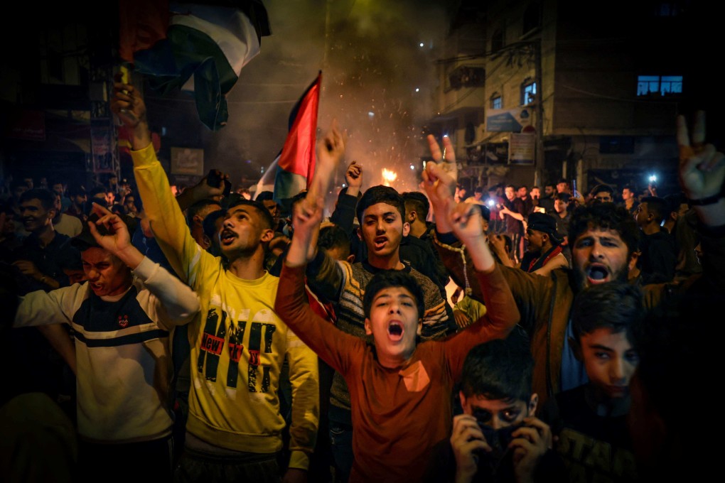 Palestinians shout slogans during a rally in Gaza city early on Saturday condemning overnight clashes in Israeli-annexed east Jerusalem. Photo: AFP