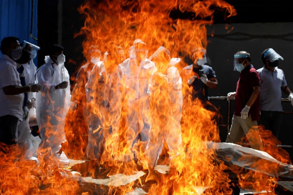 A funeral service is held in New Delhi as the number of cases in the country continues to rise. Photo: Reuters