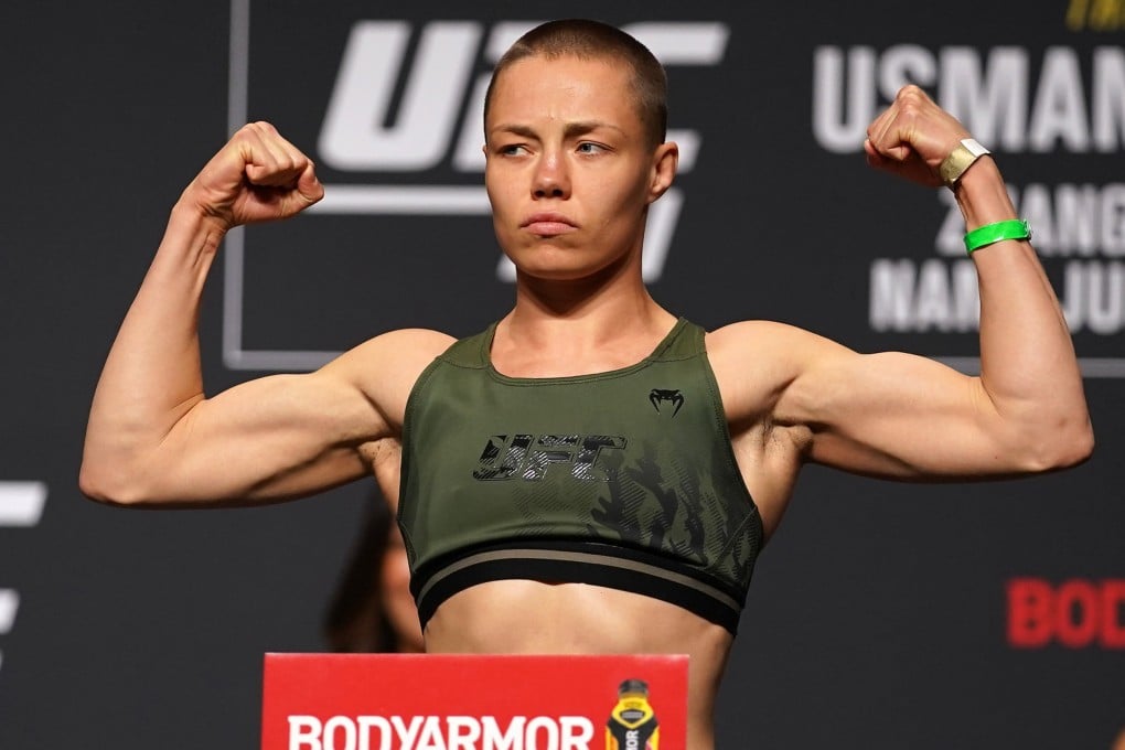 Rose Namajunas flexes while on the scale during weigh-ins for UFC 261. at VyStar Veterans Memorial Arena. Photo: Jasen Vinlove-USA TODAY Sports