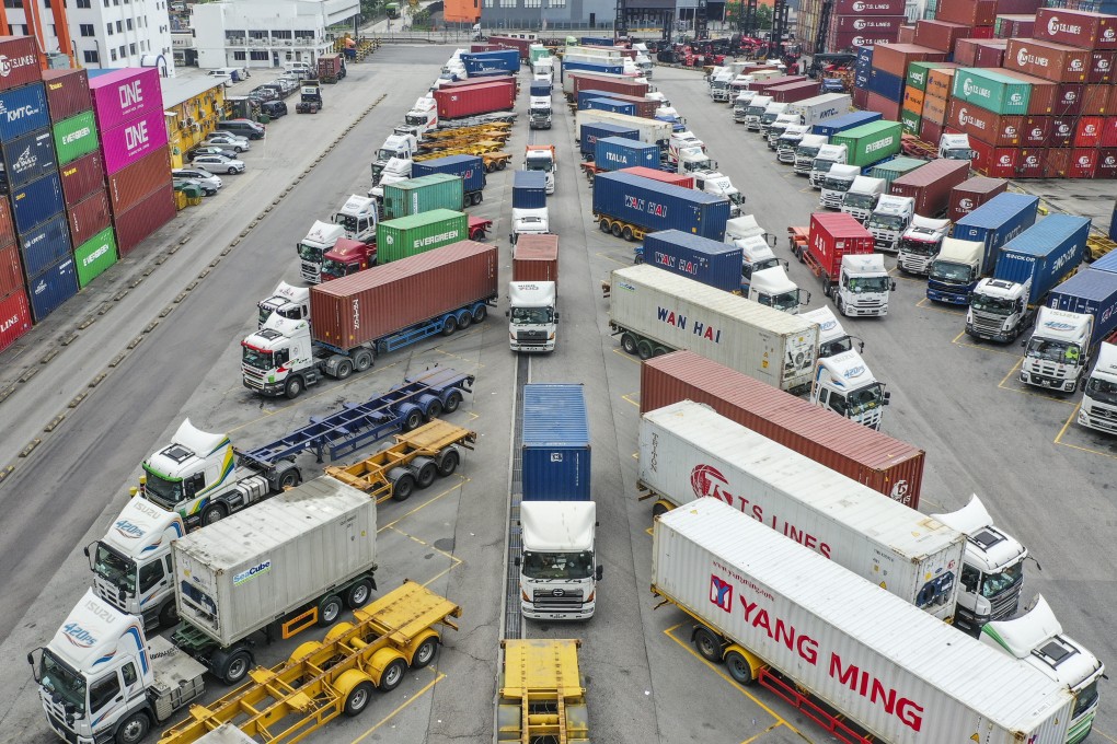 Trucks queue at the Hong Kong Container Terminal. Photo: Roy Issa