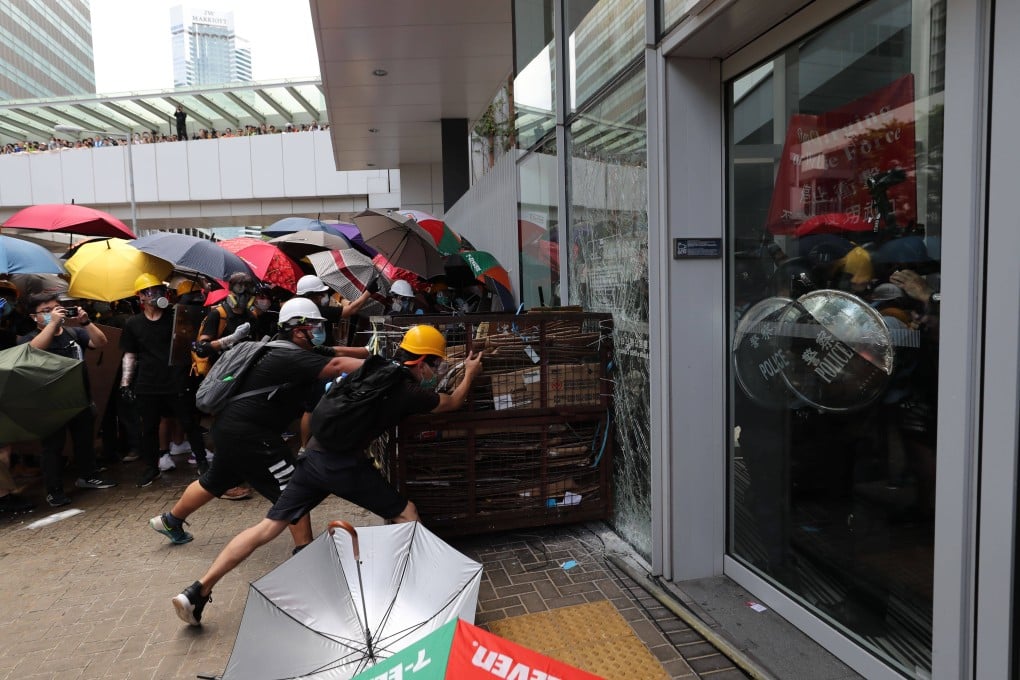Protesters smash their way into the Legislative Council complex on July 1, 2019. Photo: Sam Tsang