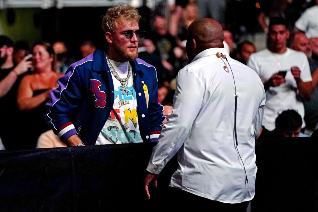 YouTube star Jake Paul is confronted by ringside announcer Daniel Cormier at UFC 261. Photo: Jasen Vinlove/USA TODAY Sports
