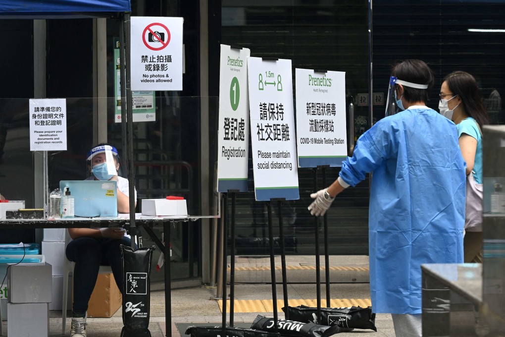A woman visits a Covid-19 testing centre outside the Immigration Department’s headquarters in Hong Kong on Saturday. Photo: AFP