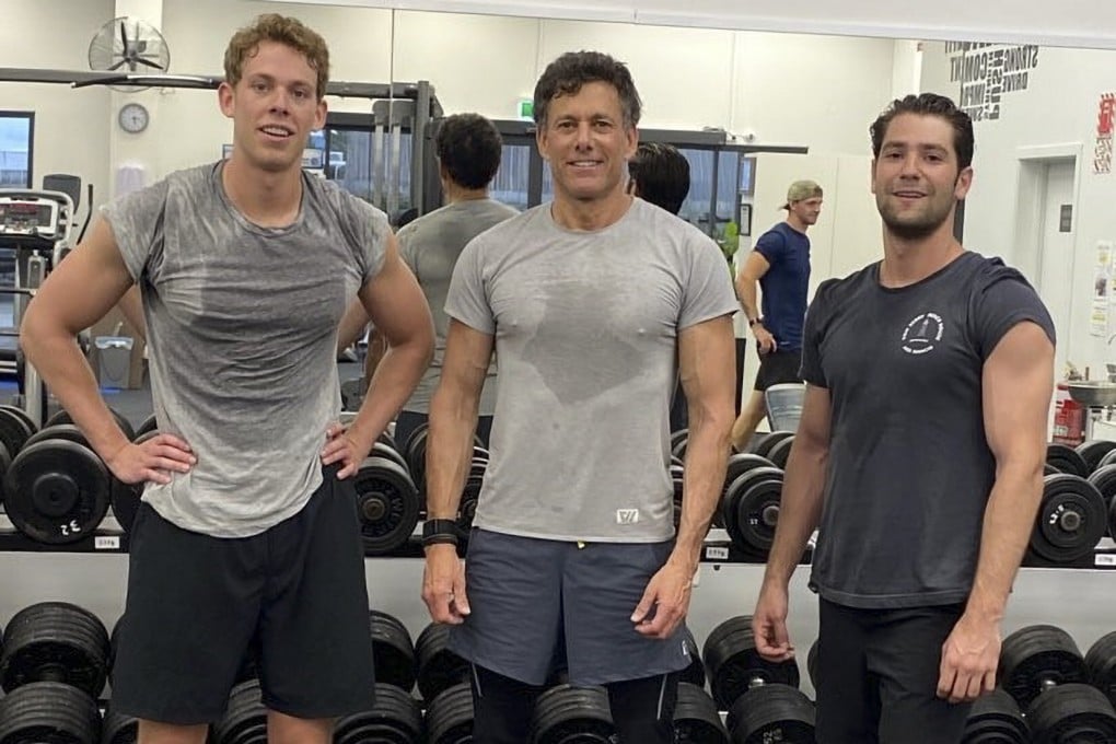 Strauss Zelnick maintains 8 per cent body fat at 63 years old. Zelnick (centre) with his son Lucas (left) and Xander Chase.