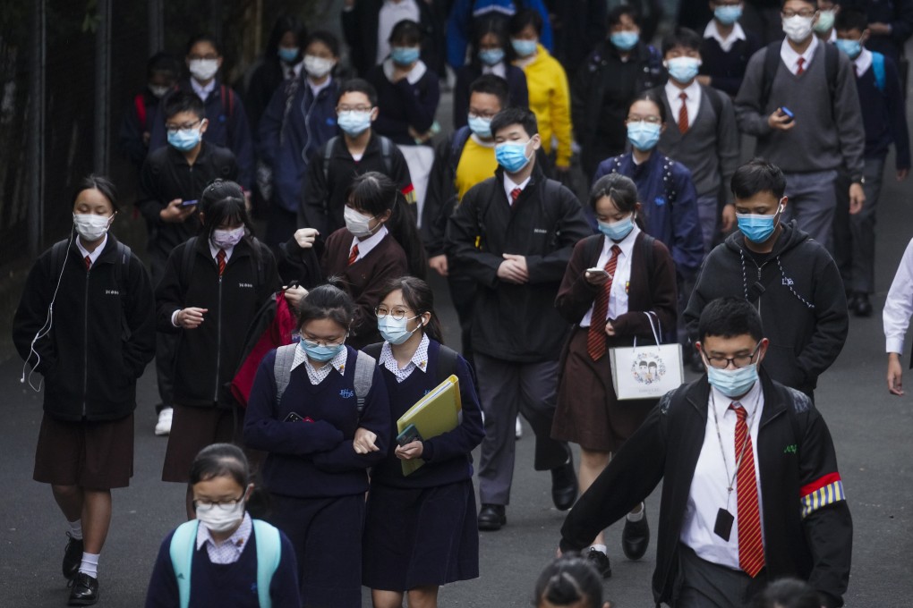 Students in Hong Kong head to school on November 30 when school was reopened following a fall in the number of Covid-19 cases. Children need an environment in where they can communicate and interact with each other. Photo: Winson Wong