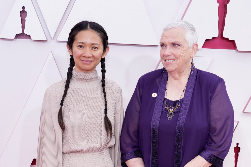 Chloe Zhao, left, and Charlene Swankie arrive on the red carpet for the 93rd Academy Awards in Los Angeles on Sunday. Photo: Reuters